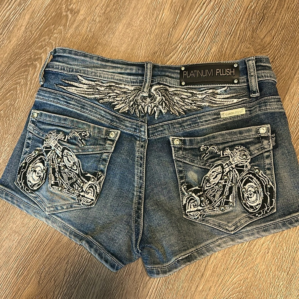 Super cute studded jean shorts with motorcycle design!